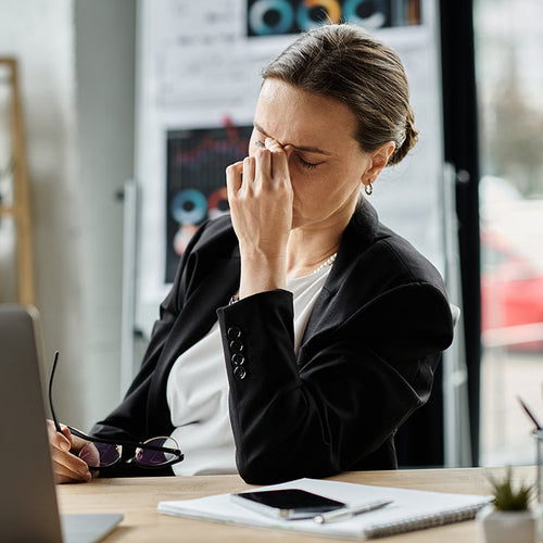 stressed woman sitting desk